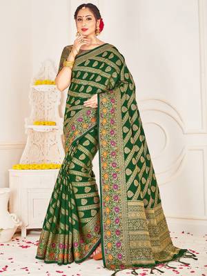 Adorn A Lovely Traditional Look Wearing This Pretty Silk Based Saree In Green Color. This Saree And Blouse Are Fabricated On Banarasi Art Silk Beautified With Weave All Over. Buy 