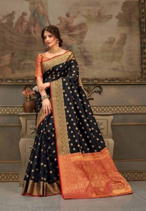 Look Attractive Wearing This Beautiful Designer Silk Based Saree In Black Color Paired With Red Colored Blouse. This Saree And Blouse Are Fabricated On Handloom Silk Beautified With Weave All Over. It Is Light In Weight And Easy To Carry All Day Long. 