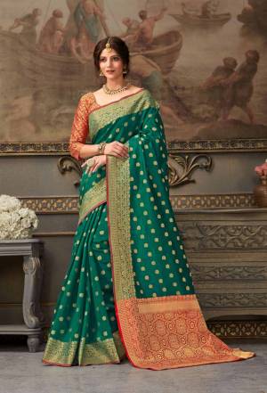 Look Attractive Wearing This Beautiful Designer Silk Based Saree In Sea Green Color Paired With Red Colored Blouse. This Saree And Blouse Are Fabricated On Handloom Silk Beautified With Weave All Over. It Is Light In Weight And Easy To Carry All Day Long. 