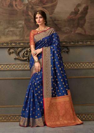 Look Attractive Wearing This Beautiful Designer Silk Based Saree In Royal Blue Color Paired With Red Colored Blouse. This Saree And Blouse Are Fabricated On Handloom Silk Beautified With Weave All Over. It Is Light In Weight And Easy To Carry All Day Long. 