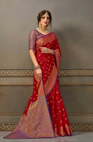Look Attractive Wearing This Beautiful Designer Silk Based Saree In Red Color Paired With Purple Colored Blouse. This Saree And Blouse Are Fabricated On Handloom Silk Beautified With Weave All Over. It Is Light In Weight And Easy To Carry All Day Long. 