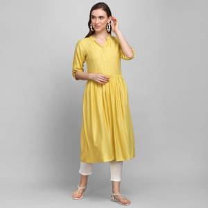 Must Have Piece To Your Wardrobe Is Here With This Readymade Kurti In Yellow Color Fabricated On Rayon With Self Work. This Kurti Is Suitable For Semi-Casual As Well As Festive Wear When Styled With Oxidize Jewelley And Sheer Dupatta. 
