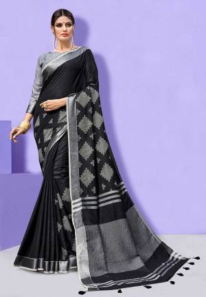 Flaunt Your Rich And Elegant Taste Wearing This Linen Based Rich Saree In Black Color Paired With Grey Colored Blouse. This Saree And Blouse Are Fabricated On Linen Beautified With Prints, So It Is Light In Weight And Easy To Carry All Day Long. 