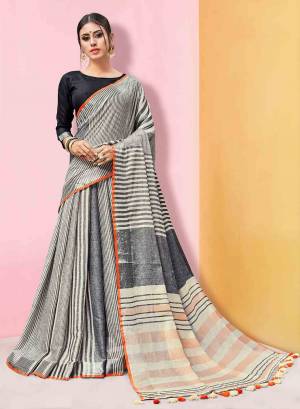 Grab This Pretty Simple Printed Saree In Black And White Color Paired with Black Colored Blouse. This Saree And Blouse Are Fabricated On Linen Beautified With Prints. Its Rich Fabric And Color Will Earn You Lots Of Compliments From onlookers. 