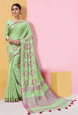 Flaunt Your Rich And Elegant Taste Wearing This Linen Based Rich Saree In Light Green Color Paired With Light Green Colored Blouse. This Saree And Blouse Are Fabricated On Linen Beautified With Prints, So It Is Light In Weight And Easy To Carry All Day Long. 