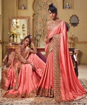 You Will Definitely Earn Lots Of Compliments Wearing This Pretty Saree In Peach Color Paired With Multi Colored Blouse. This Saree Is Fabricated On Soft Art Silk Which Also Gives A Rich Look To Your Personality.