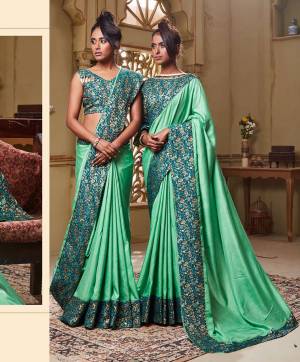 Flaunt Your Rich Taste Wearing This Elegant Looking Saree In Sea Green Color Paired With Blue Colored blouse. This Saree Is Rich Based Beautified With Broad Attractive Border. It Is Light In Weight And Easy To Carry All Day Long. 