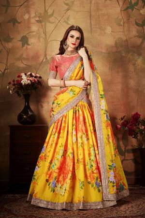 Get Ready For The Upcoming Wedding Season With This Beautiful Designer Lehenga Choli In Dark Peach Colored Blouse Paired with Contrasting Yellow Colored Lehenga And Dupatta. Its Pretty Embroidred Blouse Is Fabricated On Art Silk Paired with Orgenza Fabricated Printed Lehenga and Dupatta. 