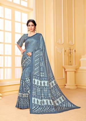 Get Ready For The Upcoming Winters With This Lovely Saree In Steel Blue Color. This Saree And Blouse Are Fabricated On Pashmina Beautified With Prints All Over. Its Rich Fabric and Color Will Earn You Lots Of Compliments From Onlookers. 