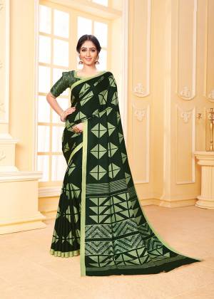 Get Ready For The Upcoming Winters With This Lovely Saree In Dark Green Color. This Saree And Blouse Are Fabricated On Pashmina Beautified With Prints All Over. Its Rich Fabric and Color Will Earn You Lots Of Compliments From Onlookers. 