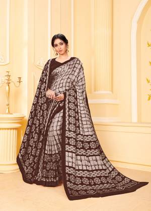 Add This Pretty Designer Saree To Your Wardrobe In Brown Color Beautified With Prints All Over. This Saree And Blouse Are Fabricated Pashmina Which Is Suitable For the Upcoming Winters. Buy Now.