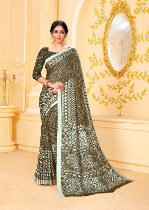 Add This Pretty Designer Saree To Your Wardrobe In Dark Olive Green Color Beautified With Prints All Over. This Saree And Blouse Are Fabricated Pashmina Which Is Suitable For the Upcoming Winters. Buy Now.