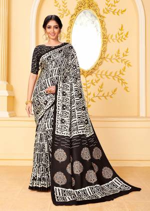 Get Ready For The Upcoming Winters With This Lovely Saree In Black And White Color. This Saree And Blouse Are Fabricated On Pashmina Beautified With Prints All Over. Its Rich Fabric and Color Will Earn You Lots Of Compliments From Onlookers. 