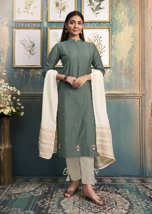 Be Ready For This Festive Season With This Readymade Straight Kurti In Teal Green Color Paired With Off-White Colored Dupatta. This Kurti Is Art Silk Based Paired With Linen Silk Dupatta. 