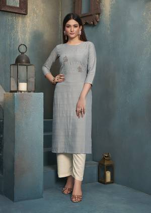 Grab This Designer Readymade Pair Of Kurti In Grey Color Paired With White Colored Bottom. Its top Is Fabricated On Rayon Paired With Rayon Fabricated bottom. Both Its Fabrics Are Light Weight , Durable And Easy To Carry All Day Long. 