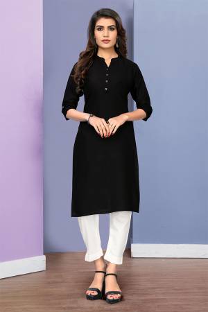 Simple and Elegant Looking Readymade Straight Kurti Is Here In Black Color Fabricated On Rayon. This Plain Kurti Can Be Paired With Same Or contrasting Colored Bottom. 