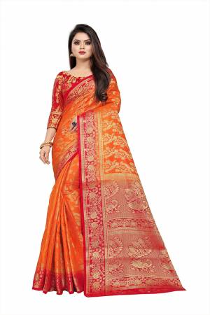 Celebrate This Festive Season In A Proper Traditonal Look Wearing This Silk Based Saree In Orange Color Paired With Red Colored Blouse. This Saree And Blouse Are Fabricated On Art Silk Beautified with Weave. 