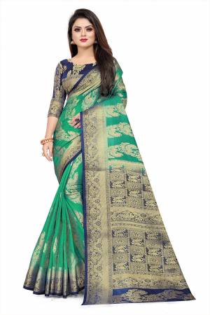 Celebrate This Festive Season In A Proper Traditonal Look Wearing This Silk Based Saree In Sea Green Color Paired With Royal Blue Colored Blouse. This Saree And Blouse Are Fabricated On Art Silk Beautified with Weave. 