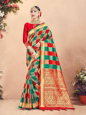 Here Is Rich Silk Based Designer Saree In Teal Green And Red Color Paired With Red Colored Blouse. This Saree And Blouse Are Fabricated On Banarasi Art Silk Beautified With Weave And Checks Pattern All Over. 