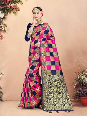 Here Is Rich Silk Based Designer Saree In Rani Pink and Navy Blue Color Paired With Navy Blue Colored Blouse. This Saree And Blouse Are Fabricated On Banarasi Art Silk Beautified With Weave And Checks Pattern All Over. 
