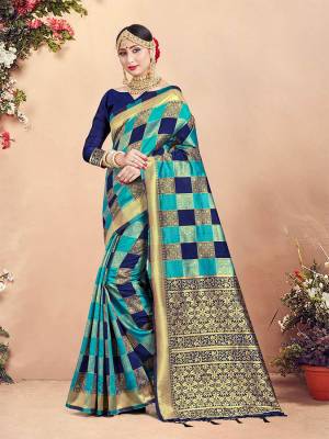 Here Is Rich Silk Based Designer Saree In Blue And Navy Blue Color Paired With Navy Blue Colored Blouse. This Saree And Blouse Are Fabricated On Banarasi Art Silk Beautified With Weave And Checks Pattern All Over. 