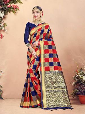 Here Is Rich Silk Based Designer Saree In Red And Navy Blue Color Paired With Navy Blue Colored Blouse. This Saree And Blouse Are Fabricated On Banarasi Art Silk Beautified With Weave And Checks Pattern All Over. 