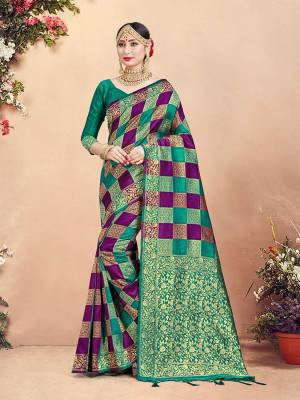 Here Is Rich Silk Based Designer Saree In Purple And Sea Green Color Paired With Sea Green Colored Blouse. This Saree And Blouse Are Fabricated On Banarasi Art Silk Beautified With Weave And Checks Pattern All Over. 