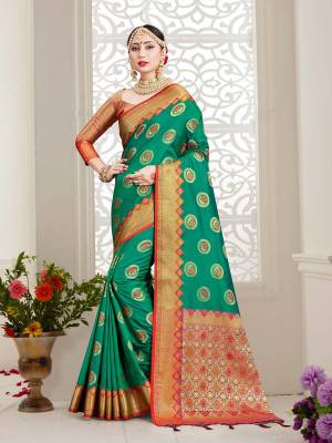 Look Beautiful Wearing This Rich Designer Saree In Sea Green Color Paired With Golden Colored Blouse. This Saree And Blouse Are Fabricated On Banarasi Art Silk Beautified With Weave. Buy Now