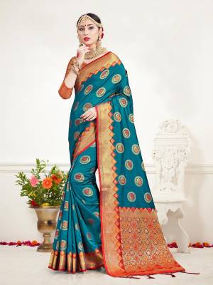 Here Is A Proper Traditional Looking Designer Silk Based saree In?Blue Color Paired With Golden Colored Blouse. This Saree and Blouse Are Fabricated On Banarasi Art Silk Beautified With Attractive Weave.