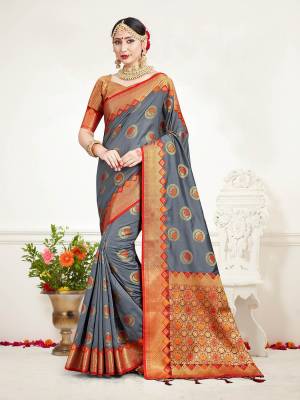 Look Beautiful Wearing This Rich Designer Saree In Grey Color Paired With Golden Colored Blouse. This Saree And Blouse Are Fabricated On Banarasi Art Silk Beautified With Weave. Buy Now