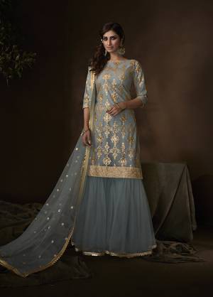 Shine Bright Wearing This Lovely Designer Sharara Suit In All Over Steel Blue Color. Its Top, Bottom And Dupatta Are Fabricated On Net Beautified With Attractive Embroidery Work. Buy This Pretty Suit Now.