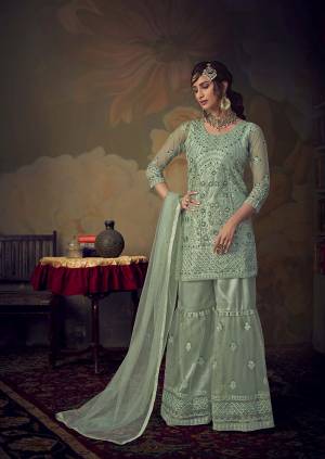 You Will Definitely Earn Lots Of Compliments Wearing This Beautiful Designer sharara Suit In Pastel Blue color. Its Top, Bottom and Dupatta Are Fabricated On Net Beautified With Pretty Tone To Tone Embroidery. Its Top Is Semi-Stitched With Fully Stitched Sharara. Buy Now.