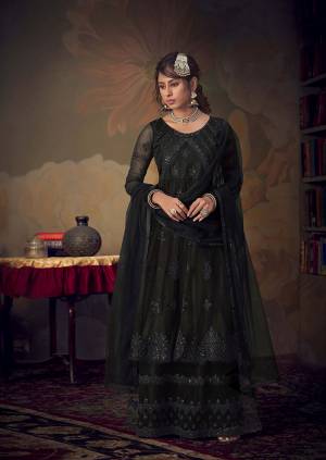 You Will Definitely Earn Lots Of Compliments Wearing This Beautiful Designer sharara Suit In Black color. Its Top, Bottom and Dupatta Are Fabricated On Net Beautified With Pretty Tone To Tone Embroidery. Its Top Is Semi-Stitched With Fully Stitched Sharara. Buy Now.