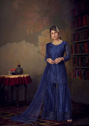 You Will Definitely Earn Lots Of Compliments Wearing This Beautiful Designer sharara Suit In Royal Blue color. Its Top, Bottom and Dupatta Are Fabricated On Net Beautified With Pretty Tone To Tone Embroidery. Its Top Is Semi-Stitched With Fully Stitched Sharara. Buy Now.