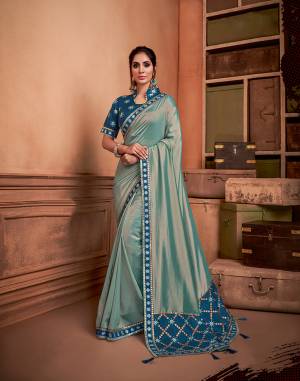 A very charming and inifinitely gorgeous , lustorus silk saree with an elaborately embroidered short pallu and deep teal blouse is a choice of women who like to flaunt traditional fashion with style. Pair it with statement jhumkis to complete the look. 