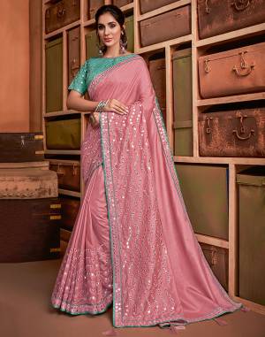 A very festive combination of pastel pink and sea green , embellished with mirror embroidery - this saree will enhance your feminine style , uplift your fashion and give you that fabulous look you're looking for this season. 