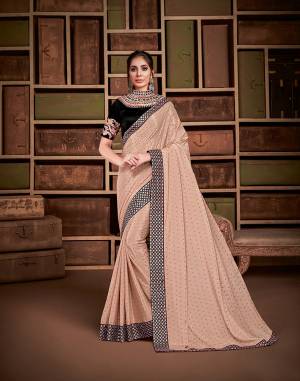 Look regal and pretty and charmingly attractive in this very soft pastel saree paired with a bold back border and blouse with a necklace-style embroidery. 