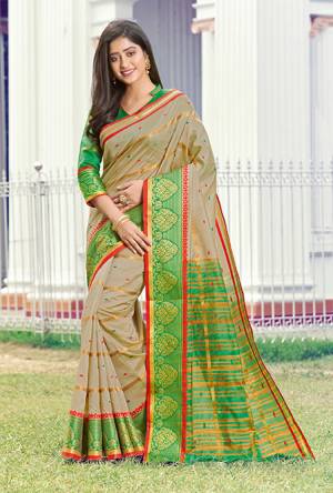Simple And Elegant Looking Silk Based saree Is Here In Cream Color Paired With Green Colored Blouse. This Saree and Blouse Are Fabricated On Handloom Silk Beautified With Weave All Over. Buy Now.
