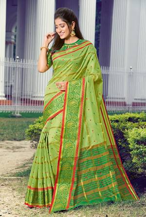 Celebrate This Festive Season Wearing This Pretty Saree In Green Color Paired With Green Colored Blouse. This Saree And Blouse Are Fabricated On Handloom Silk Beautified With Weave. 
