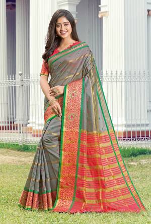 Celebrate This Festive Season Wearing This Pretty Saree In Grey Color Paired With Dark Pink Colored Blouse. This Saree And Blouse Are Fabricated On Handloom Silk Beautified With Weave. 