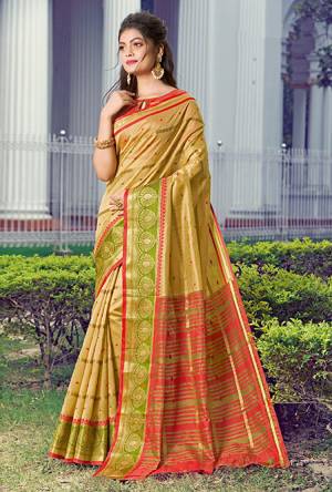 Celebrate This Festive Season Wearing This Pretty Saree In Beige Color Paired With Red Colored Blouse. This Saree And Blouse Are Fabricated On Handloom Silk Beautified With Weave. 