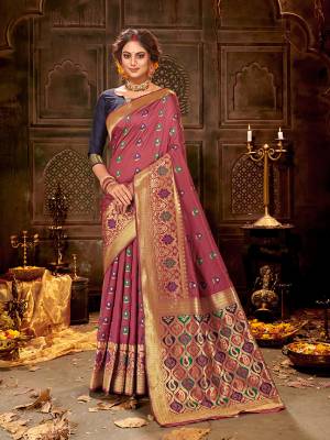 Celebrate This Festive Season Wearing This Pretty Saree In Onion Pink And Navy Blue Color. This Saree And Blouse Are Fabricated On Banarasi Art Silk Beautified With Weave All Over.