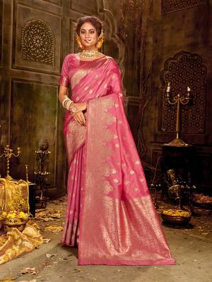 Celebrate This Festive Season Wearing This Pretty Saree In Pink Color. This Saree And Blouse Are Fabricated On Banarasi Art Silk Beautified With Weave All Over.