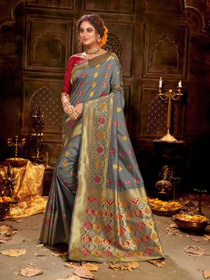 Flaunt Your Rich And Elegant Taste Wearing Thi Silk Based saree Is Here In Grey And Red Color. This Saree and Blouse Are Fabricated On Banarasi Art Silk Beautified With Weave All Over. Buy Now.