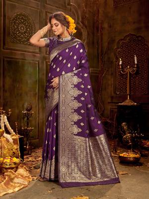 Celebrate This Festive Season Wearing This Pretty Saree In Purple Color. This Saree And Blouse Are Fabricated On Banarasi Art Silk Beautified With Weave All Over.
