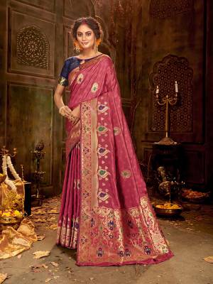 Celebrate This Festive Season Wearing This Pretty Saree In Onion Pink And Navy Blue Color. This Saree And Blouse Are Fabricated On Banarasi Art Silk Beautified With Weave All Over.
