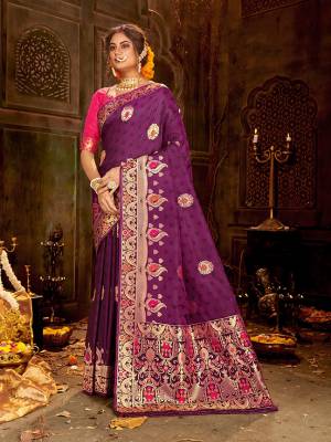 Celebrate This Festive Season Wearing This Pretty Saree In Purple and Rani Pink Color. This Saree And Blouse Are Fabricated On Banarasi Art Silk Beautified With Weave All Over.