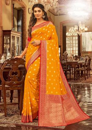Celebrate This Festive Season Wearing This Pretty Designer Silk Based Saree In Orange Color Paired With Red Colored Blouse. This Saree And Blouse Are Fabricated On Chanderi Cotton Beautified With Weave All Over. 