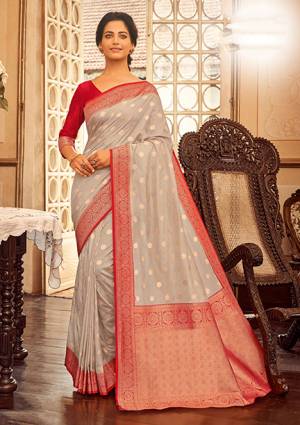 Flaunt Your Rich And Elegant Taste In This Grey Colored Saree Paired With Red Colored Blouse. This Saree And Blouse Are Fabricated On Chanderi Cotton Beautified With Weave. Buy This Saree Now.