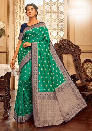Flaunt Your Rich And Elegant Taste In This Sea Green Colored Saree Paired With Navy Blue Colored Blouse. This Saree And Blouse Are Fabricated On Chanderi Cotton Beautified With Weave. Buy This Saree Now.